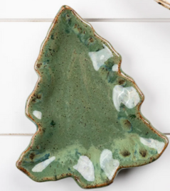 A hand-painted ceramic dish in the shape of a Christmas tree with a green and blue color palette.
